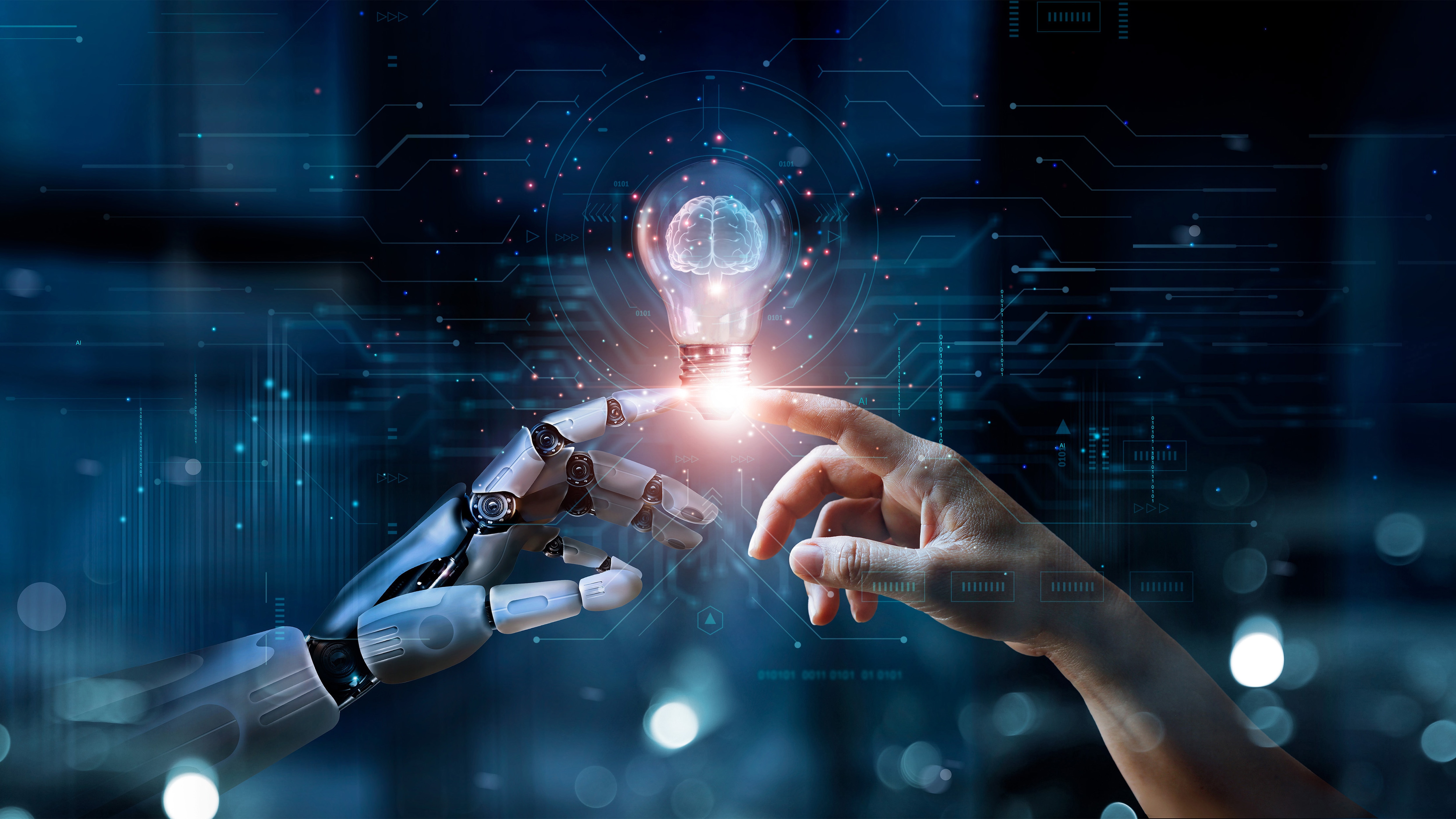 Human finger and robot finger touching an illuminated light bulb.